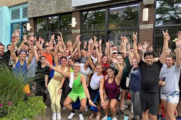 Love, Corbin event: Large group photo celebrating a CycleBar ride for the Trevor Project