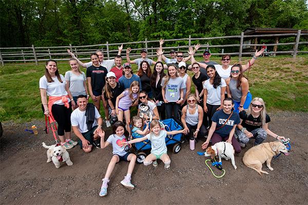Large group photo with family and dogs at a Love, Corbin event: NAMI Walks Your Way 2021