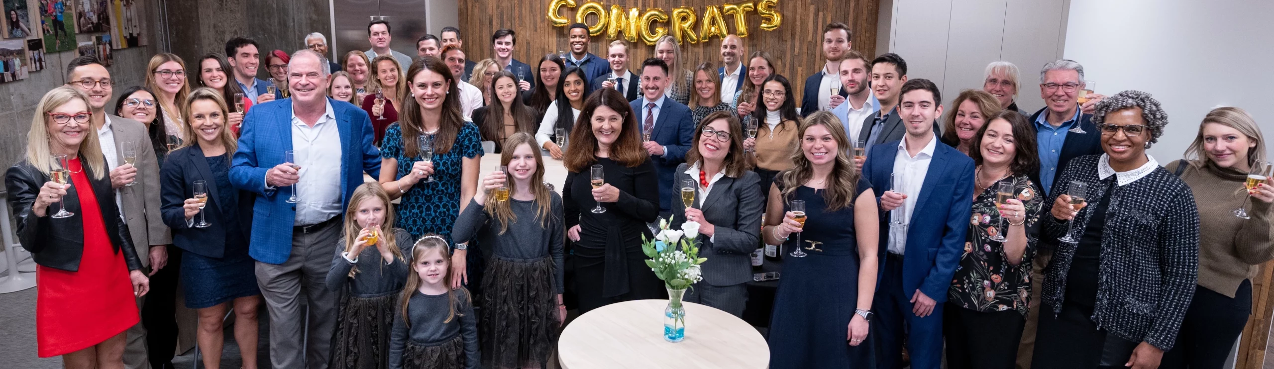 Founder & CEO, Rebecca Corbin toasting Corbin's 15 Year Anniversary with the Corbin Team, family and friends at the Farmington, CT Headquarters