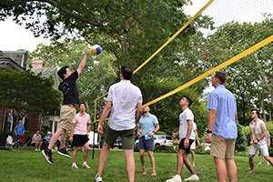 Corbin Team playing volleyball at summer 2023 picnic
